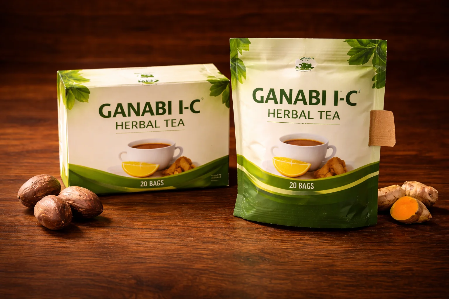 Ganabi I-C Herbal Tea box and sealed pouch on warm wooden surface with bitter kola and turmeric root